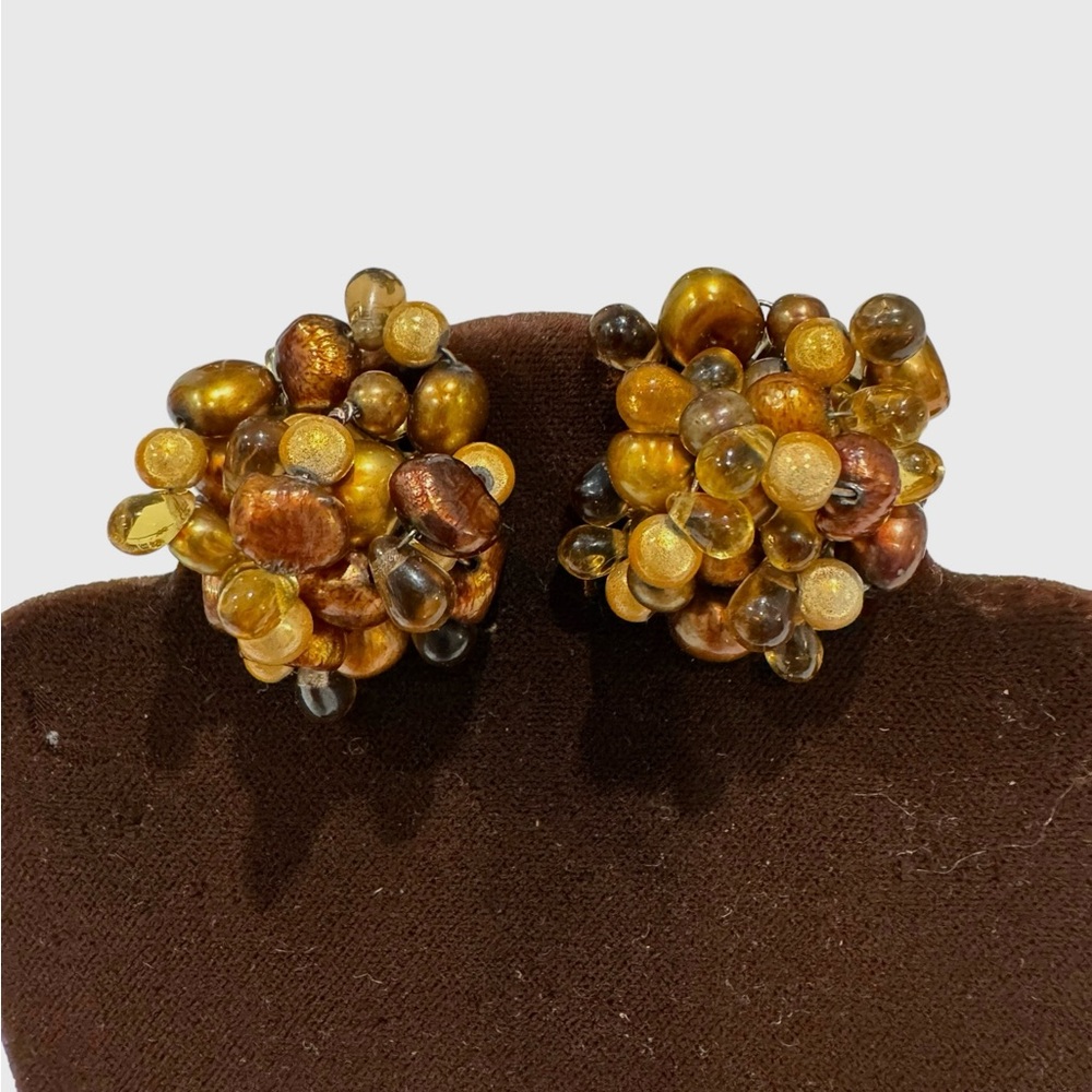 Cluster of gold, copper, yellow and brown bead earrings. Clip on.